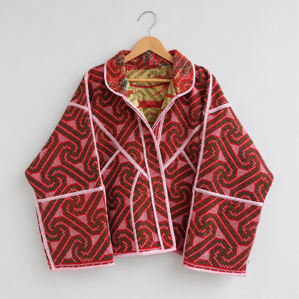 Red spiral-pattern Kantha jacket with pink piping