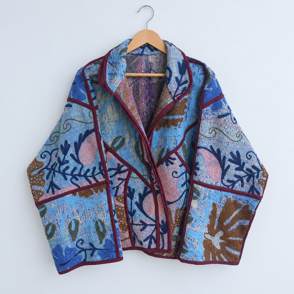 Blue Kantha jacket with navy vine embroidery and plum piping